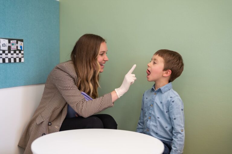 Speech pathologist with a boy